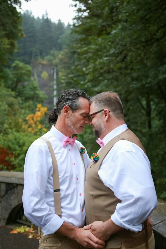 Two grooms kissing